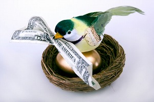 Bird on Gold Egg with Money in Beak